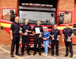 Presenting the "Thank You" certificate to Red Watch at Whitchurch Fire Station